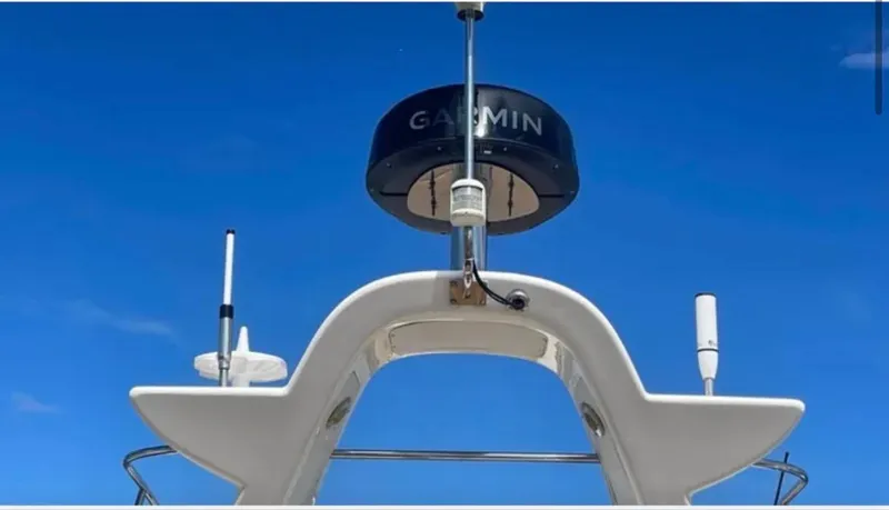  Yacht Photos Pics Sealine F425 yacht radar and antennas against a clear blue sky, 2003 model.