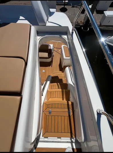  Yacht Photos Pics 2003 Sealine F425 yacht with teak deck and cushioned seating.