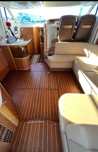  Yacht Photos Pics Luxurious interior of 2003 Sealine F425 yacht with wooden flooring and plush seating.