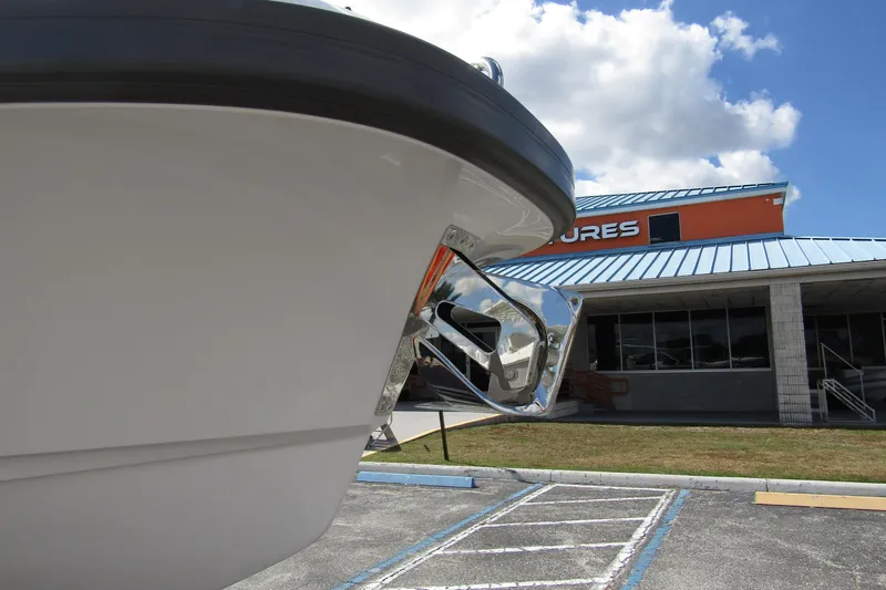  Yacht Photos Pics Front view of 2025 Nimbus Weekender 9 boat with anchor, parked near a building.