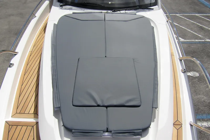  Yacht Photos Pics Nimbus Weekender 9 (2025) boat with cushioned deck and wooden accents.