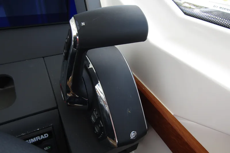  Yacht Photos Pics Throttle control lever on a 2025 Nimbus Weekender 9 boat dashboard.