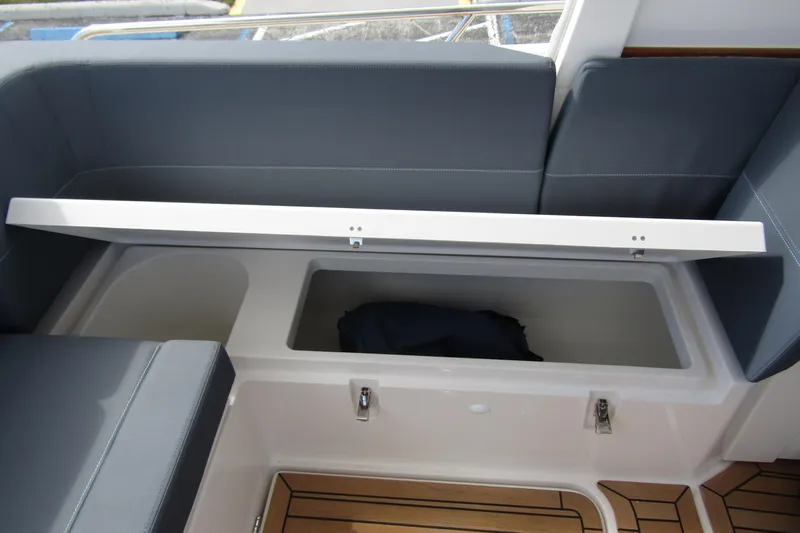  Yacht Photos Pics Storage compartment on Nimbus Weekender 9 boat, 2025 model, with cushioned seating.