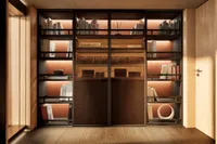 Luxurious yacht interior with elegant wooden bookshelves, ambient lighting, and modern decor, 2026 model.