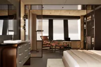 Luxurious 2026 custom motor yacht interior with modern bedroom and lounge area.