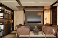 Luxurious motor yacht interior with leather seating, modern decor, and a large TV, 2026 model.