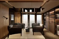 Luxurious 2026 custom motor yacht interior with modern seating and panoramic windows.