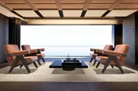 Luxurious yacht interior with modern seating, ocean view, and sleek design, 2026 model.