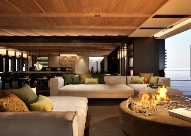 Project Ice Yacht Photos Pics Luxurious interior of 2026 custom motor yacht with cozy seating and modern fireplace.
