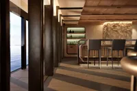 Luxurious interior of 2026 custom motor yacht with modern bar and ocean view.