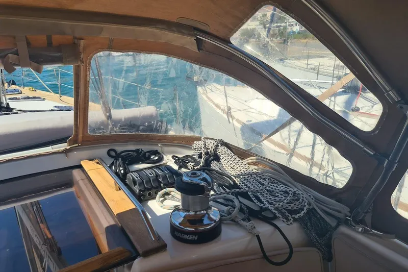  Yacht Photos Pics 2009 Jeanneau Sun Odyssey 50 DS cockpit with ropes and winch, overlooking marina.