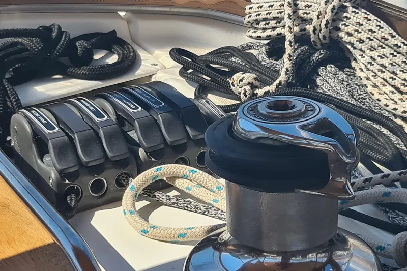 Yacht Photos Pics Close-up of Jeanneau Sun Odyssey 50 DS 2009 sailboat winch and ropes on deck.