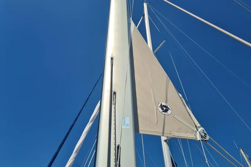  Yacht Photos Pics Sail of 2009 Jeanneau Sun Odyssey 50 DS against clear blue sky.