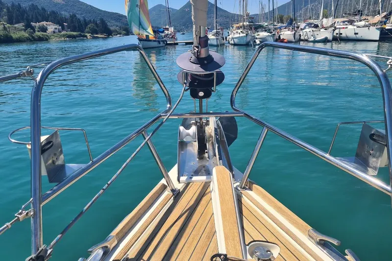  Yacht Photos Pics Jeanneau Sun Odyssey 50 DS sailboat bow view in a serene marina, 2009 model.