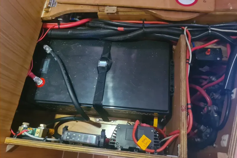  Yacht Photos Pics Battery compartment of 2009 Jeanneau Sun Odyssey 50 DS sailboat, showing wiring and connections.