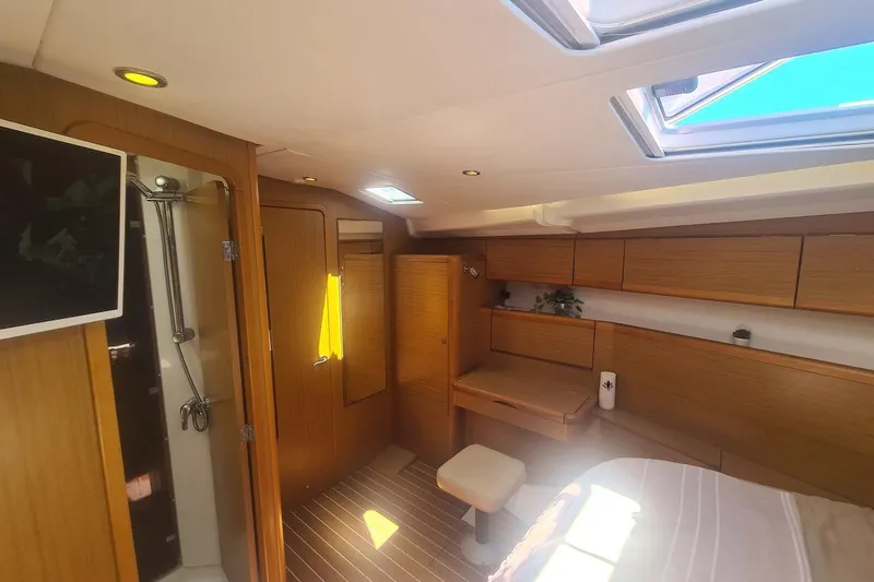  Yacht Photos Pics Luxurious interior of 2009 Jeanneau Sun Odyssey 50 DS yacht cabin with modern amenities.