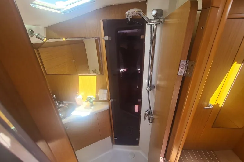  Yacht Photos Pics Interior of 2009 Jeanneau Sun Odyssey 50 DS yacht bathroom with shower and sink.