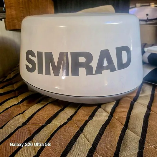 Ab2967908 Yacht Photos Pics Simrad radar dome on striped fabric, photographed with Galaxy S20 Ultra 5G.