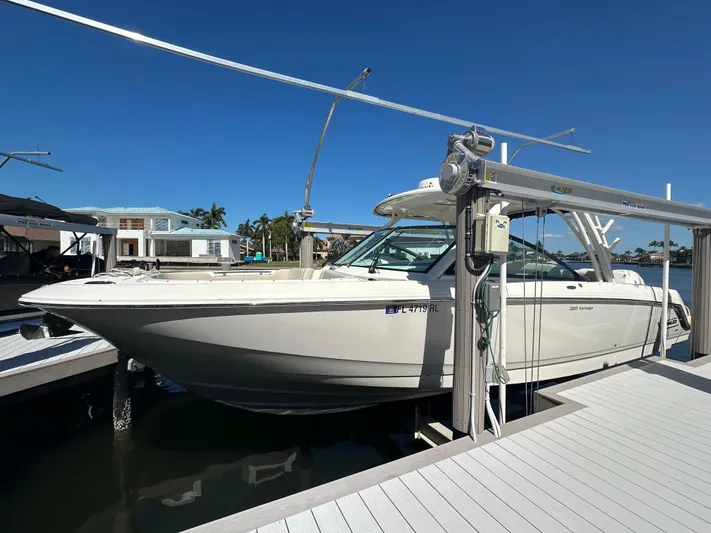  Yacht Photos Pics 2018 Boston Whaler 320 Vantage boat docked under clear blue sky.