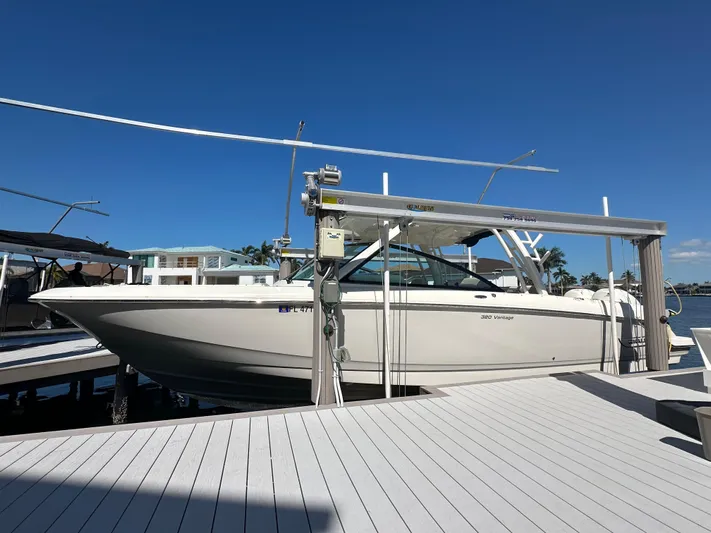  Yacht Photos Pics 2018 Boston Whaler 320 Vantage boat docked under clear blue sky.