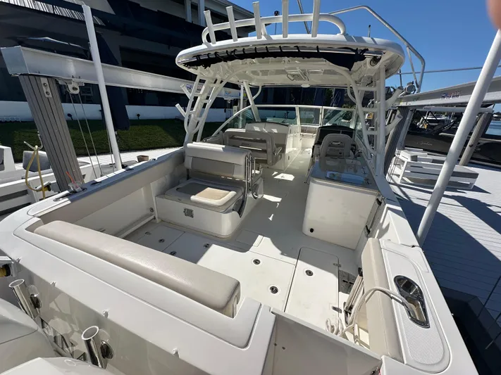  Yacht Photos Pics 2018 Boston Whaler 320 Vantage boat interior with seating and helm station.