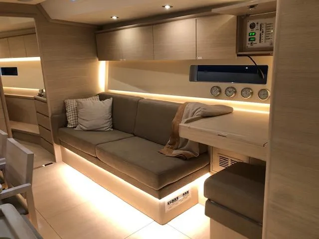 Sultans Of Swing Yacht Photos Pics Luxurious interior of 2020 Solaris 50 yacht with modern seating and ambient lighting.