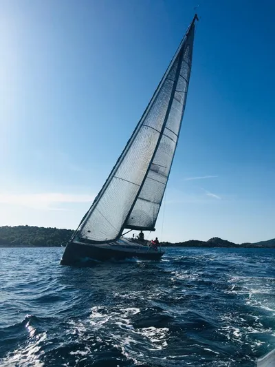 Sultans Of Swing Yacht Photos Pics Sailing yacht Solaris 50 with carbon mast on open sea, 2020 model, under clear blue sky.