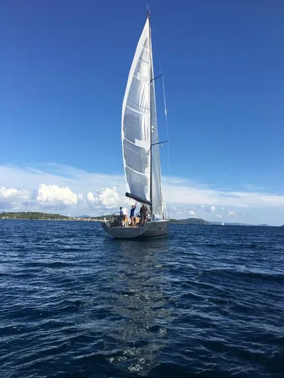 Sultans Of Swing Yacht Photos Pics Sailing yacht Solaris 50 with carbon mast on open sea, clear blue sky, 2020 model.