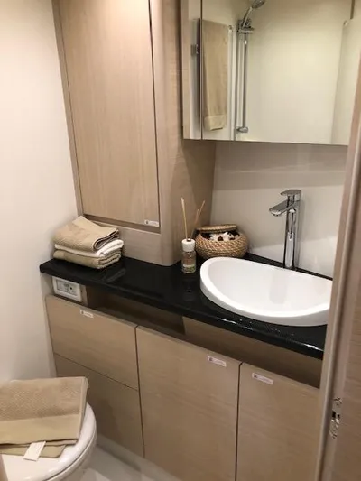 Sultans Of Swing Yacht Photos Pics Modern bathroom in 2020 Solaris 50 yacht with sleek sink and wooden cabinetry.