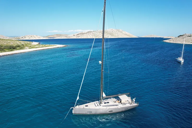 Sultans Of Swing Yacht Photos Pics Sailing yacht Solaris 50 with carbon mast in clear blue waters, 2020 model.