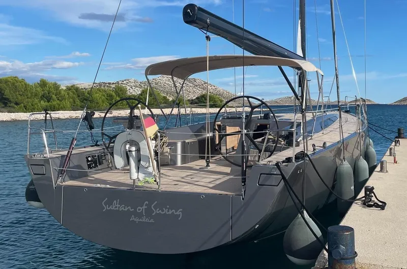 Sultans Of Swing Yacht Photos Pics Sleek 2020 Solaris 50 yacht with carbon mast docked at a serene marina.