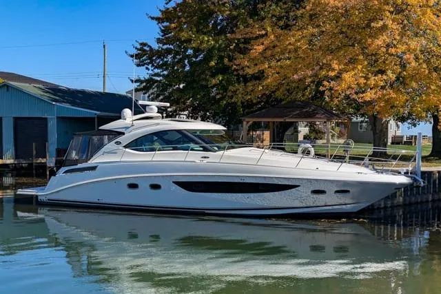 Nautalia Yacht Photos Pics 2013 Sea Ray 470 Sundancer yacht docked by autumn trees.