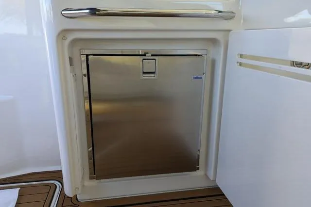 Nautalia Yacht Photos Pics Stainless steel refrigerator on 2013 Sea Ray 470 Sundancer yacht deck.