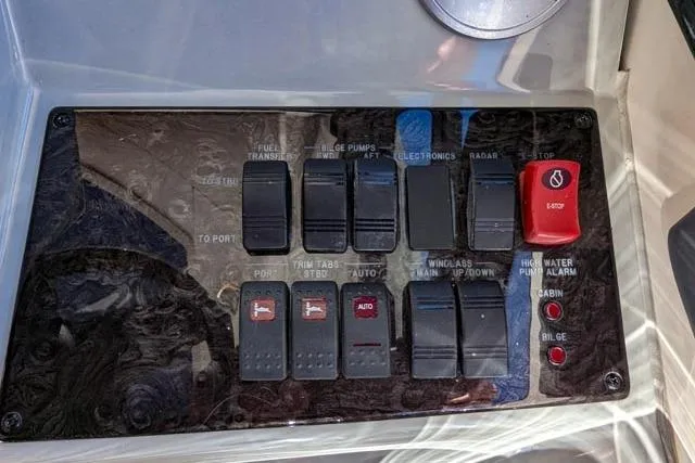 Nautalia Yacht Photos Pics Control panel of a 2013 Sea Ray 470 Sundancer boat with various switches and buttons.