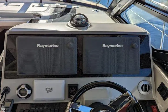 Nautalia Yacht Photos Pics Helm of 2013 Sea Ray 470 Sundancer with Raymarine navigation displays.