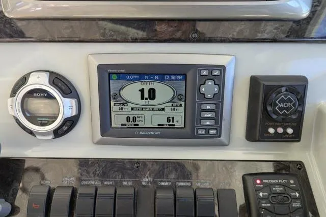 Nautalia Yacht Photos Pics Control panel of a 2013 Sea Ray 470 Sundancer with navigation and depth display.