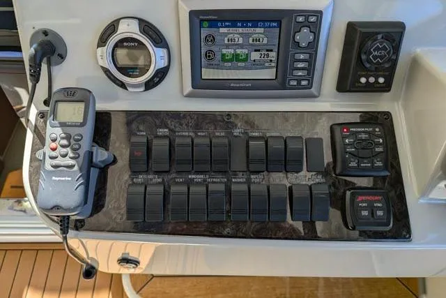 Nautalia Yacht Photos Pics Control panel of 2013 Sea Ray 470 Sundancer with navigation and communication equipment.