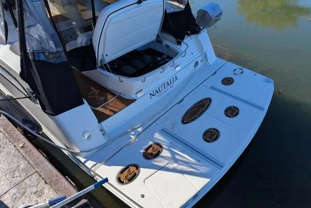 Nautalia Yacht Photos Pics 2013 Sea Ray 470 Sundancer yacht docked, featuring open storage and custom deck design.