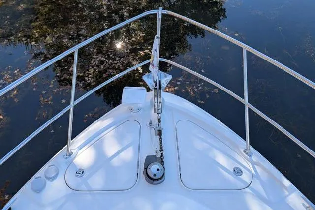 Nautalia Yacht Photos Pics Bow of 2013 Sea Ray 470 Sundancer yacht with stainless steel railings.