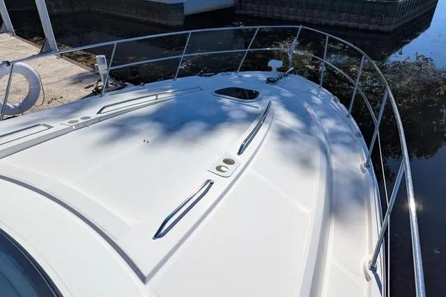 Nautalia Yacht Photos Pics 2013 Sea Ray 470 Sundancer yacht deck with sleek design and railing.