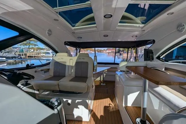 Nautalia Yacht Photos Pics Luxurious 2013 Sea Ray 470 Sundancer yacht interior with plush seating and elegant wood finishes.