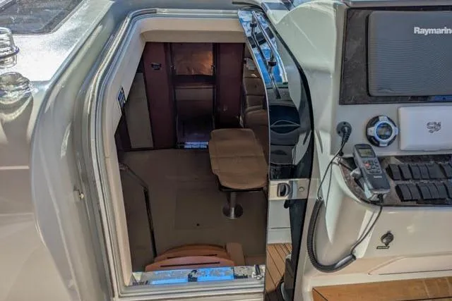 Nautalia Yacht Photos Pics 2013 Sea Ray 470 Sundancer cabin entrance with navigation equipment visible.