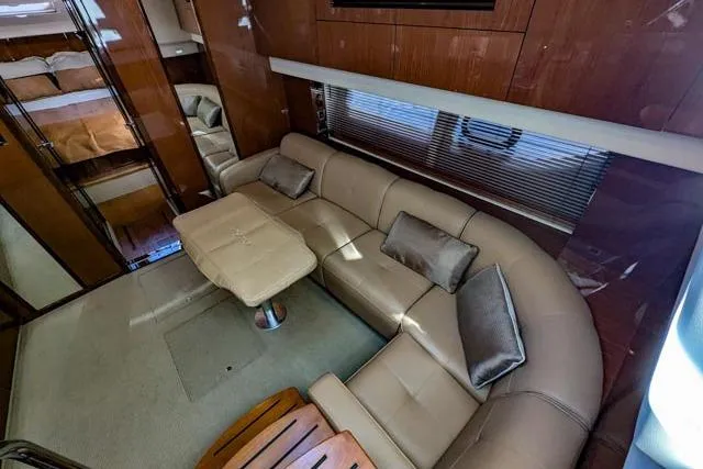 Nautalia Yacht Photos Pics Luxurious interior of 2013 Sea Ray 470 Sundancer yacht with plush seating and elegant decor.