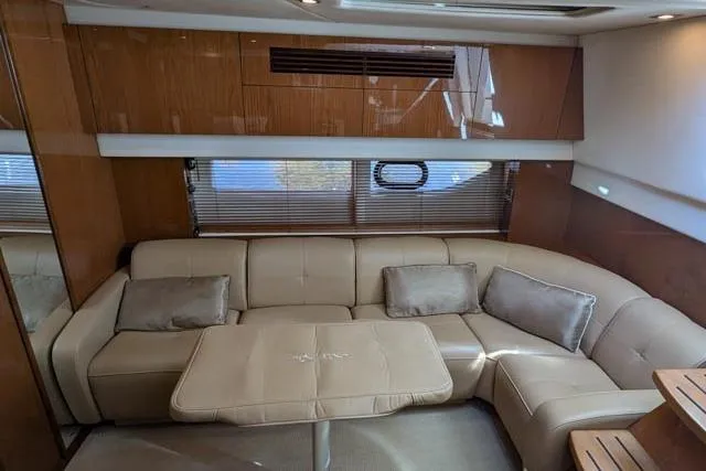 Nautalia Yacht Photos Pics Luxurious interior of 2013 Sea Ray 470 Sundancer yacht with plush seating and elegant design.