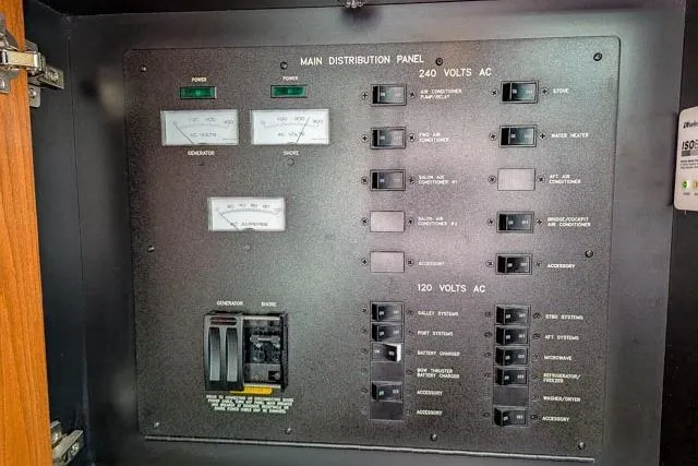 Nautalia Yacht Photos Pics Main distribution panel of 2013 Sea Ray 470 Sundancer boat, showing voltage controls and switches.