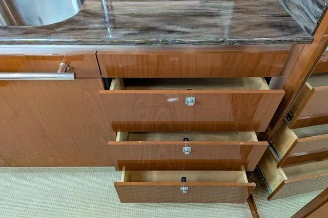 Nautalia Yacht Photos Pics Wooden drawers in a 2013 Sea Ray 470 Sundancer yacht kitchen area.