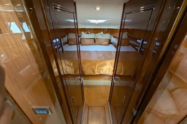 Nautalia Yacht Photos Pics Luxurious cabin interior of 2013 Sea Ray 470 Sundancer yacht with elegant wood finish.