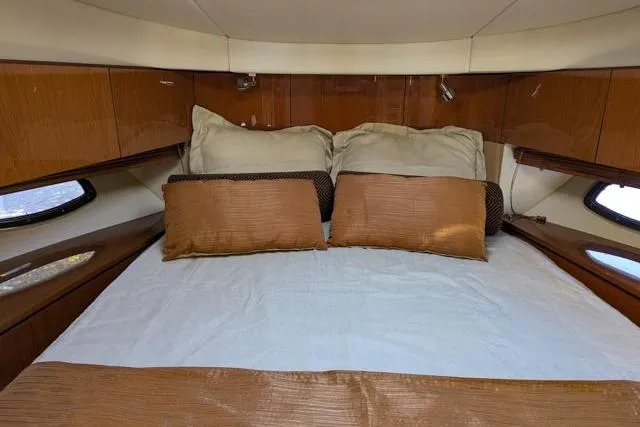 Nautalia Yacht Photos Pics Luxurious cabin interior of 2013 Sea Ray 470 Sundancer yacht with cozy bedding.