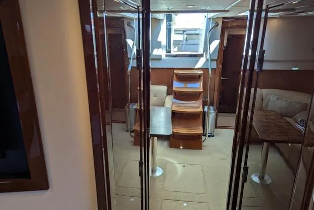 Nautalia Yacht Photos Pics Interior of 2013 Sea Ray 470 Sundancer yacht, featuring elegant wood finishes and modern design.