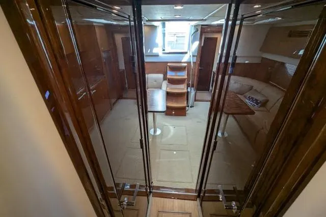Nautalia Yacht Photos Pics Luxurious interior of 2013 Sea Ray 470 Sundancer yacht with elegant wood finishes.